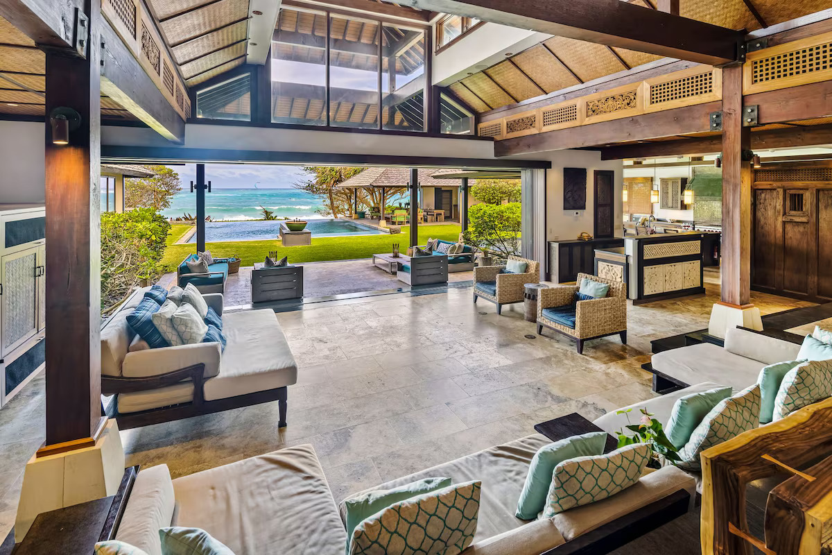 Great room with pocket doors open to pool and ocean