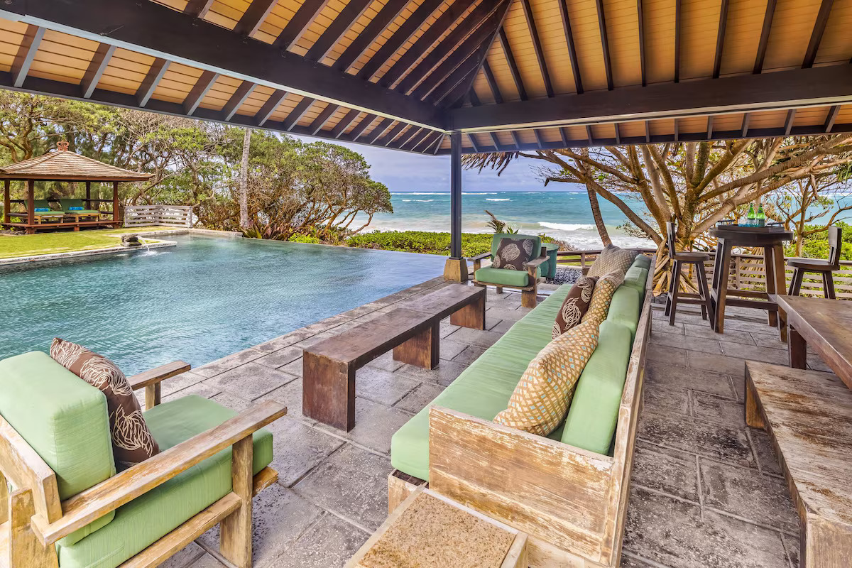 Poolside cabana seating with ocean view